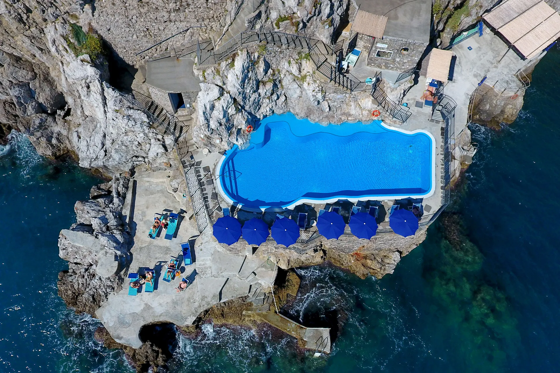 Aerial view of the infinity pool at Hotel Luna Convento over the sea of Amalfi